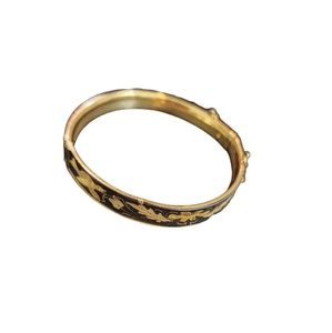 Black‎ and gold tone bracelet